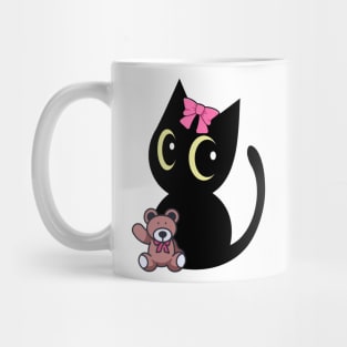 Cute black cat holds a teddy bear Mug